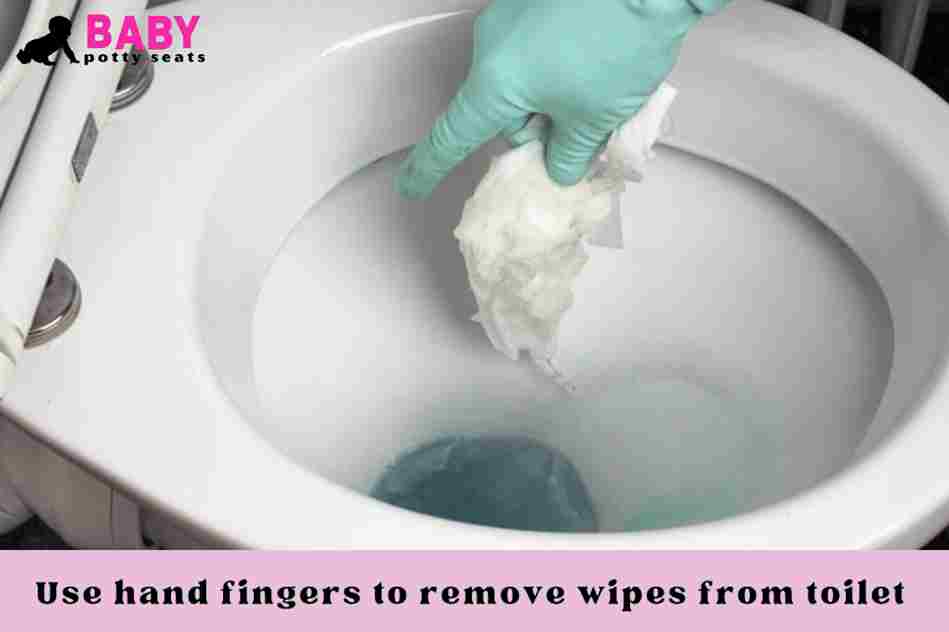 Use hand fingers to remove wipes from toilet 